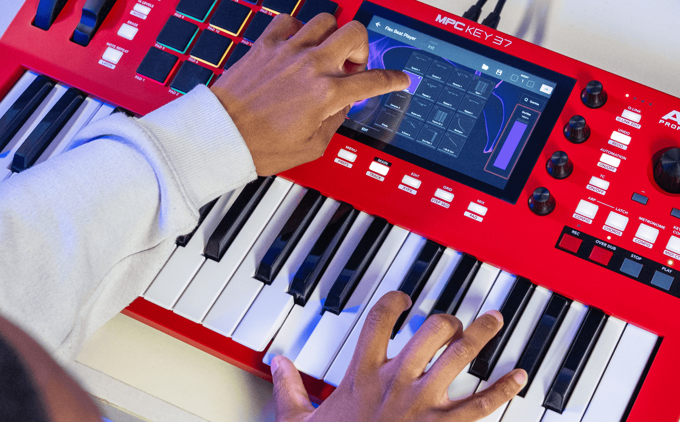 Hands on keyboard and touchscreen of the MPC Key 37