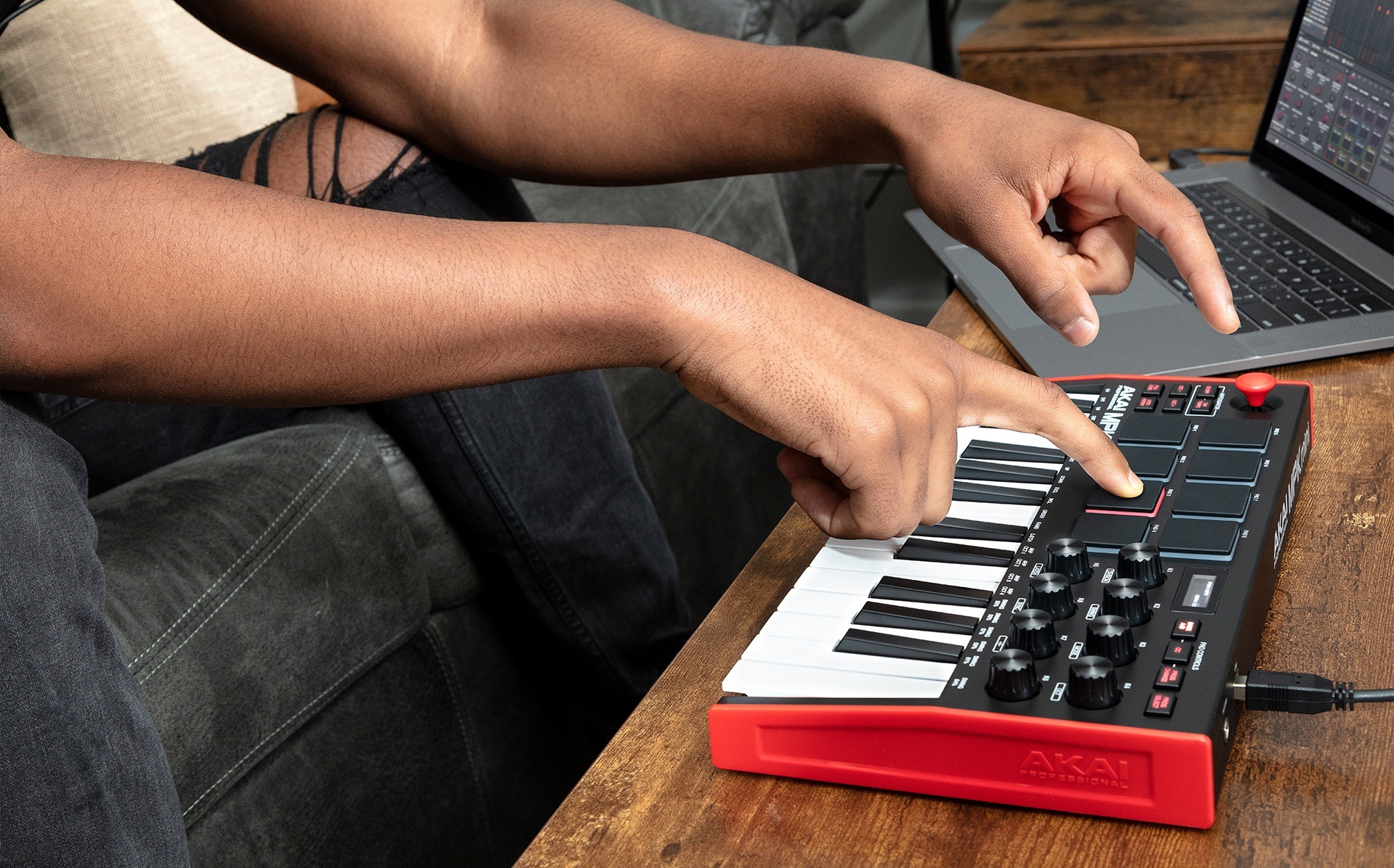 Music producer playing MPC pads on MPK Mini